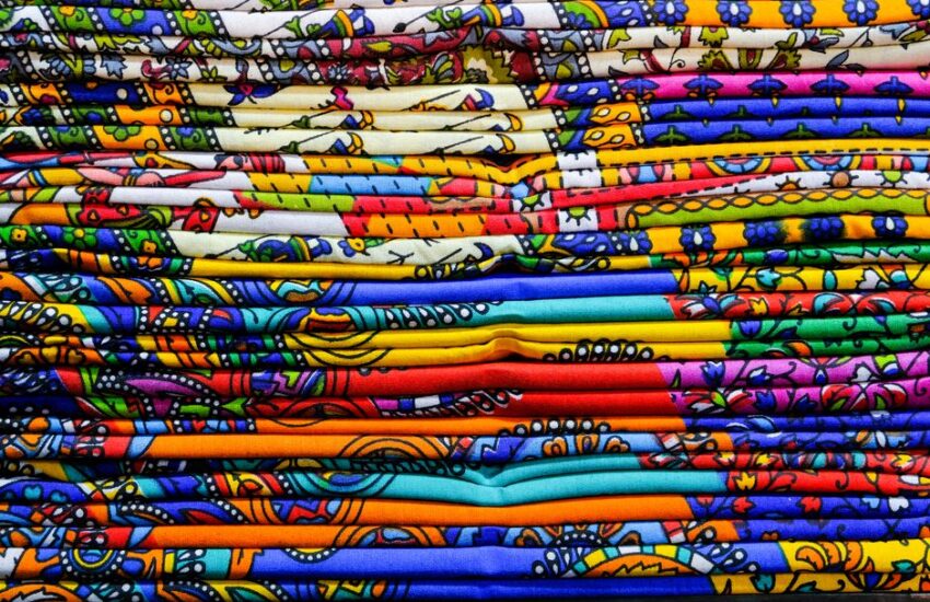 Close-up of colorful Indian textiles showcasing traditional patterns in Jaipur, India.